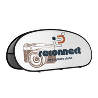 A black computer mouse features a white logo depicting a stylized camera and the text 'reconnect photography studio.'